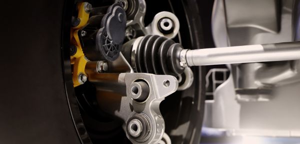 Close up of a car suspension parts system such as CV joint Repair being done