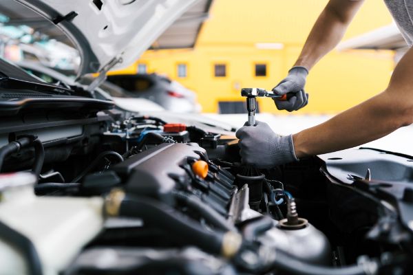 mechanic working on engine