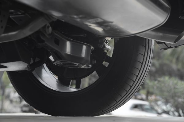exhaust system auto parts and service, detail bottom view of vehicle part metal exhaust pipe