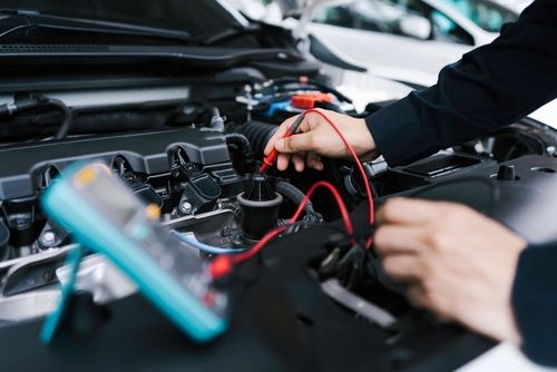 Technician Hands of car mechanic working repair in auto repair service electric battery