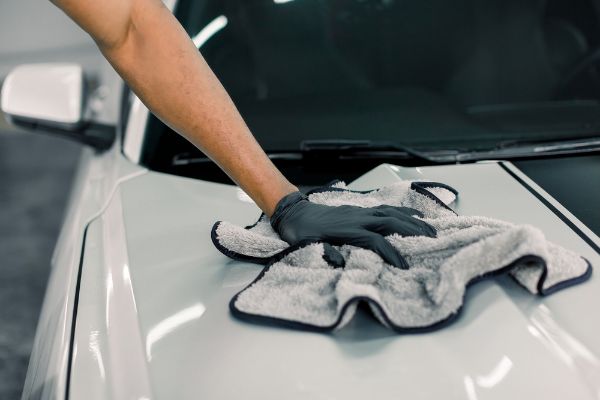 hand cleaning car