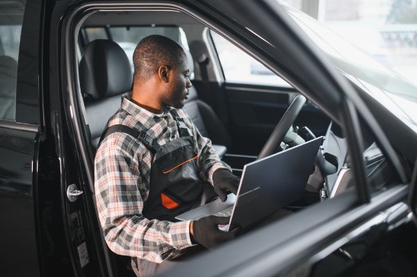 Mechanic expertly inspecting a car