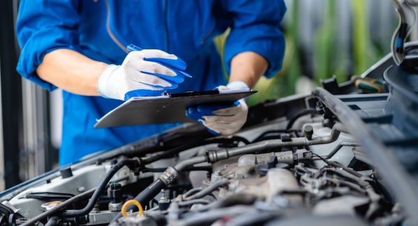 mechanic with maintenance checklist
