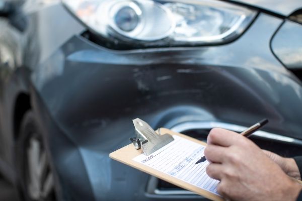 mechanic evaluating damage