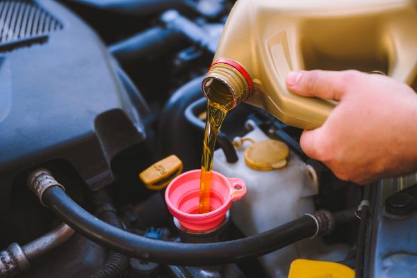Mechanic conducting a tune up on a vehicle