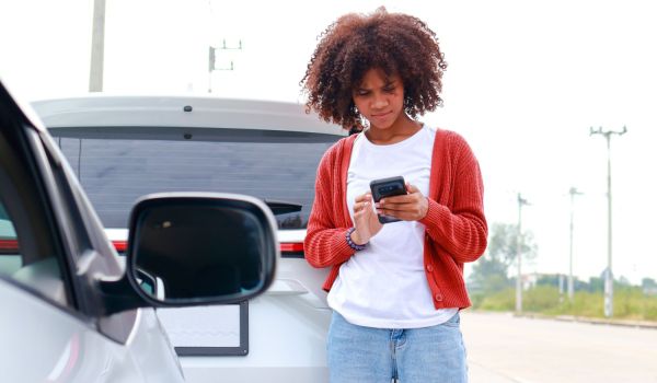 woman calling insurance afer collision