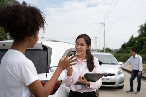 Women discussing the details at the scene of an accident