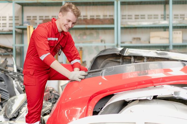 Mechanic working on doing a Collision reconditioning on a vehicle