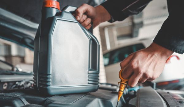mechanic checking fluids