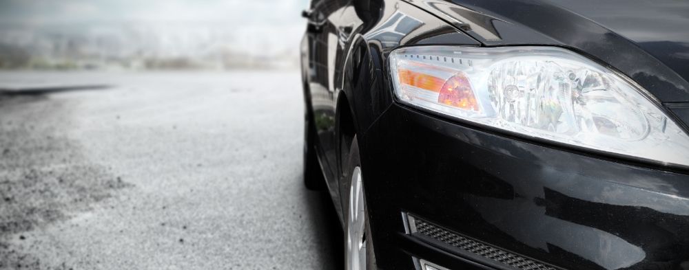 front passenger side of black car