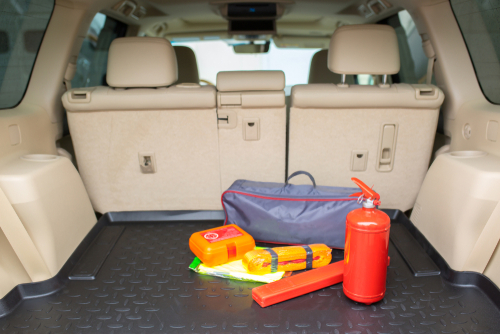 Set for a car from a fire extinguisher, tow rope, tool kit and medical kit in the trunk